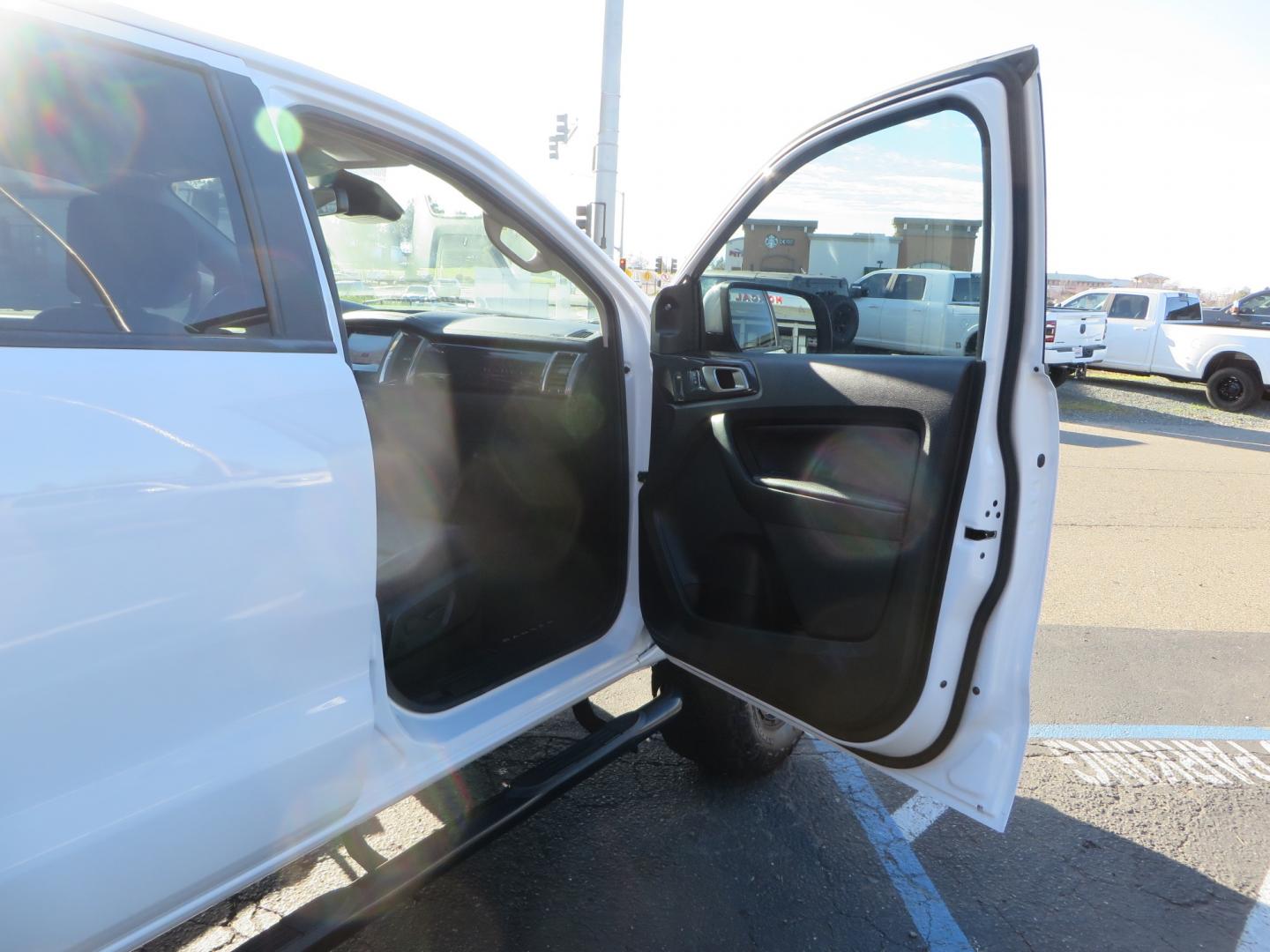 2019 White /Black Ford Ranger Lariat (1FTER4FHXKL) with an 2.3L engine, automatic transmission, located at 2630 Grass Valley Highway, Auburn, CA, 95603, (530) 508-5100, 38.937893, -121.095482 - Features a Fabtech suspension system, Fuel Offroad wheels, Nitto Ridge Grappler tires, Westin Running boards, and a Bakflip. - Photo#38